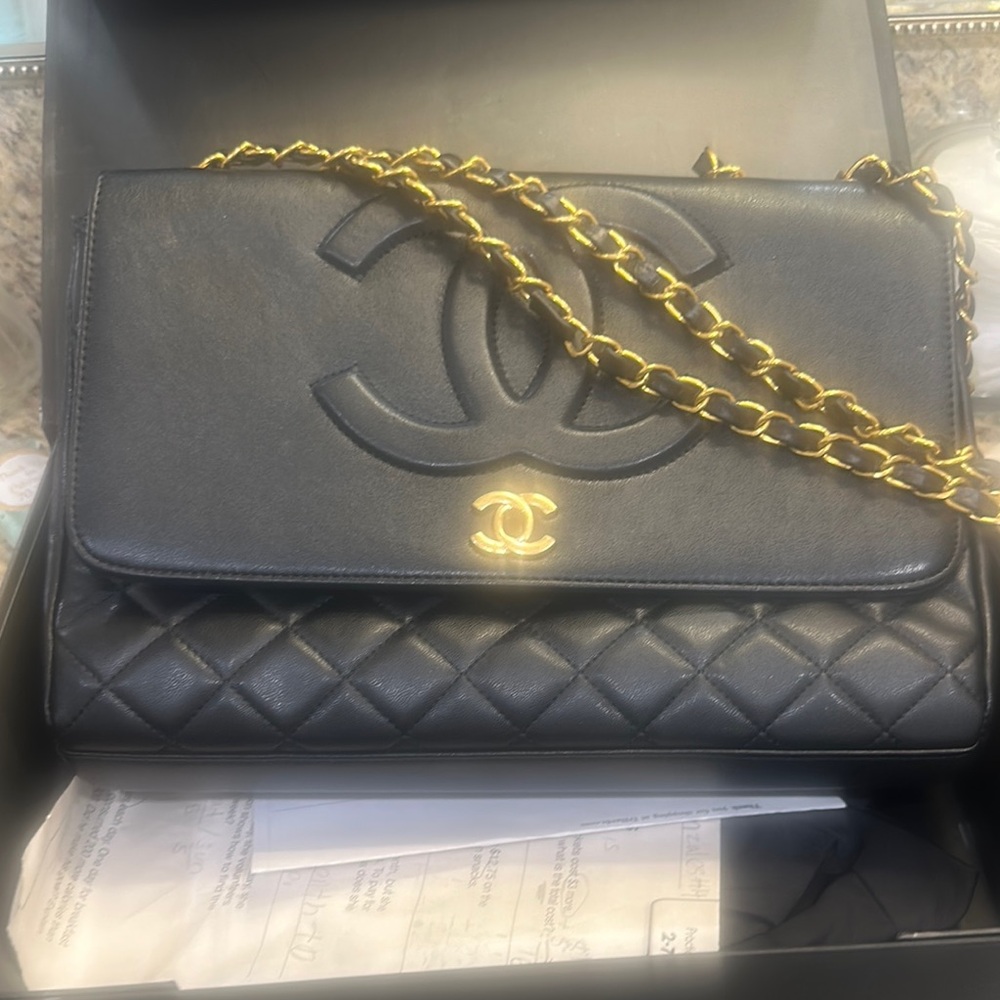 CHANEL Black and Gold Quilted Clutch with Iconic CC Logo